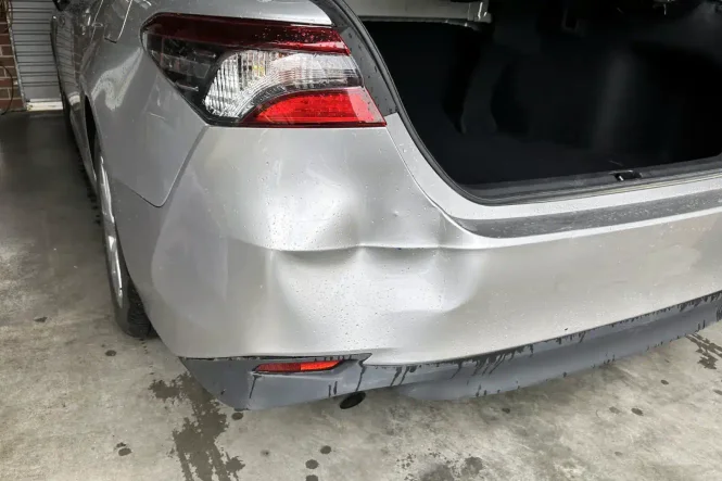 Car damage before repair - Camry Bumper Dent Repair before professional scratch repair service