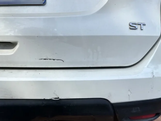 Car damage before repair - Bumper and Bootlid Plastic Crack Repair before professional scratch repair service
