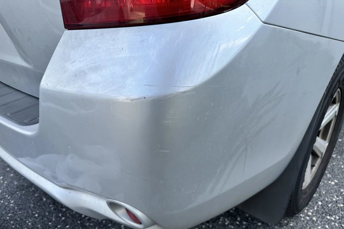 Car damage before repair - Prado Rear Bumper Scuff Repair before professional scratch repair service