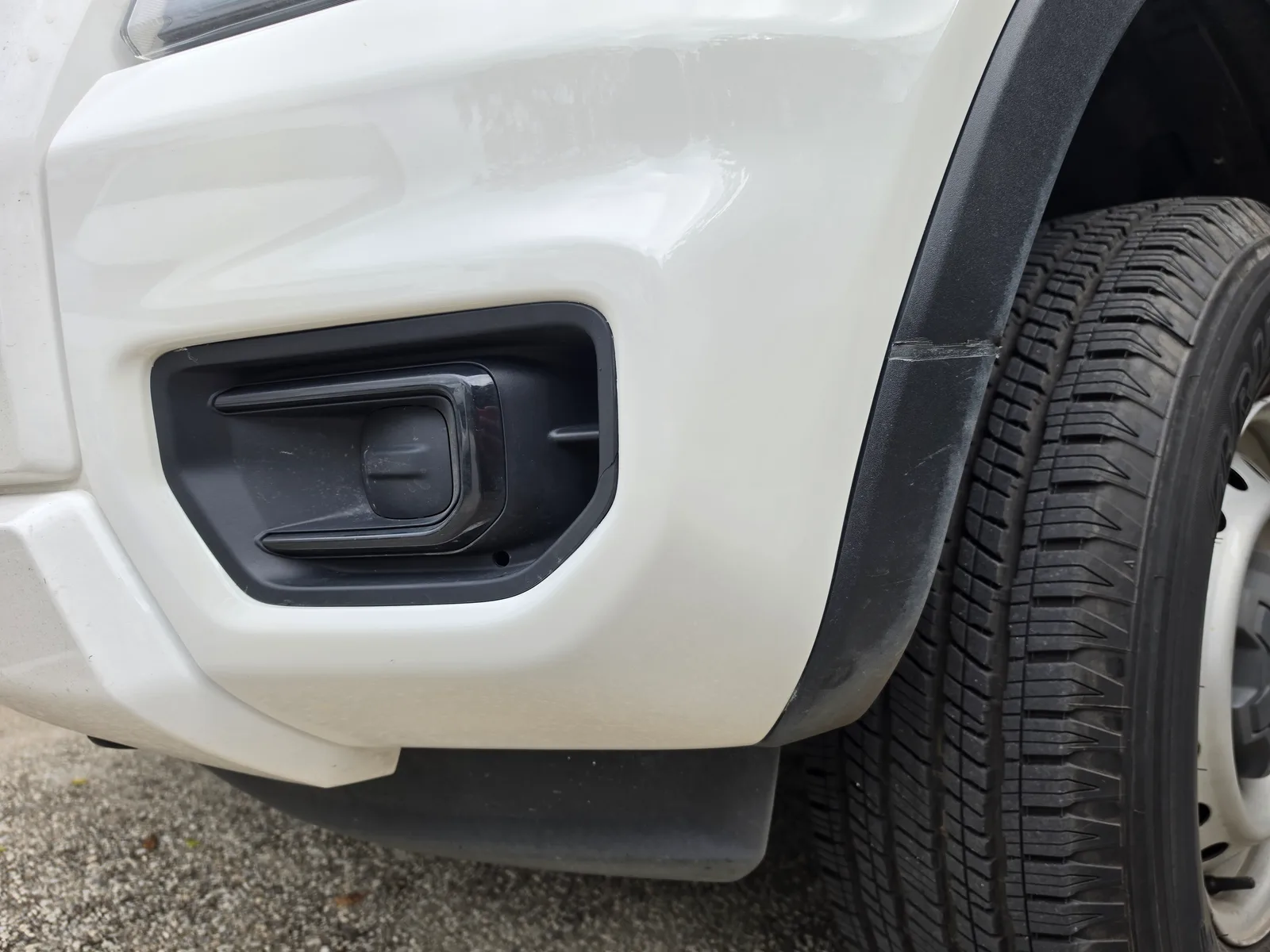 Professional car repair result - Deep bumper gouges on a ute repaired in an Oxford White colour match after expert repair by Melbourne Scratch Repairs
